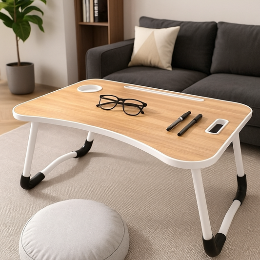Black folding laptop desk with cup holder and device slot, perfect for bed, sofa, or portable use