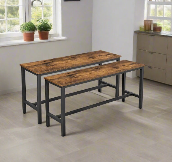 Rustic brown wooden benches with black metal frames styled under a modern dining table