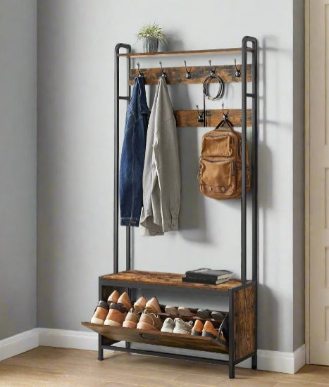 Coat rack with hooks and shoe storage shelf against a wall