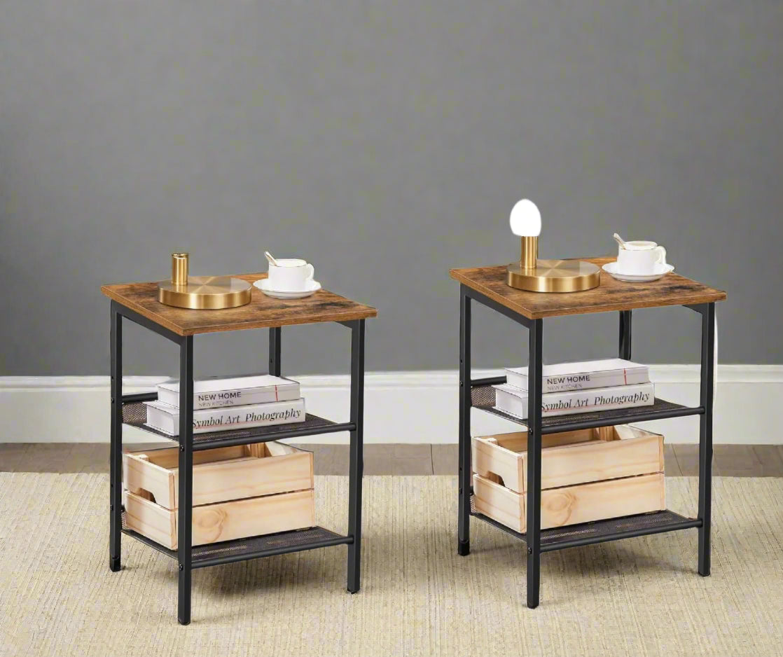 Set of two rustic brown and black side tables with adjustable mesh shelves in industrial style