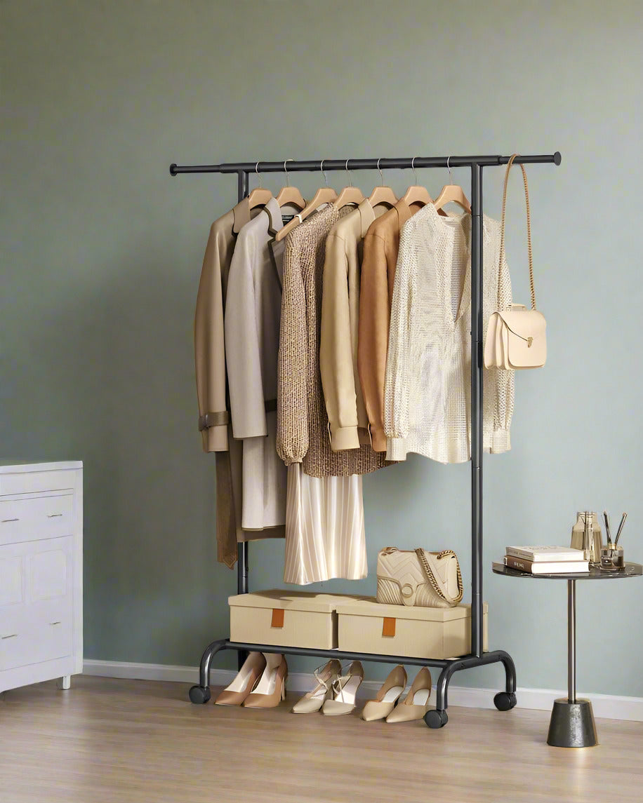 "Adjustable metal clothes rack with extendable hanging rail, lower storage bars, and swivel wheels, ideal for compact or flexible storage needs."