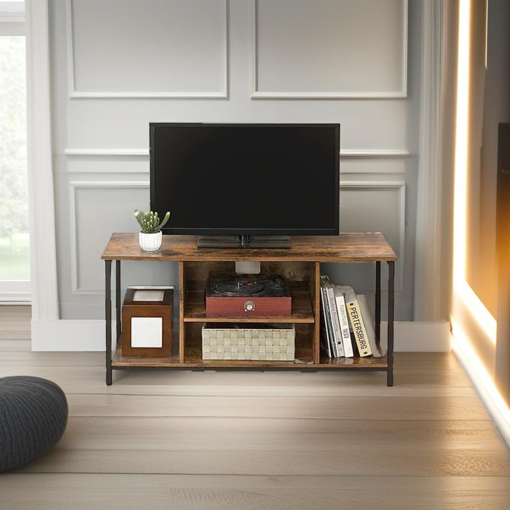 Wooden TV stand with a television, books, and decorative items in a room with light-colored walls and wooden floor.