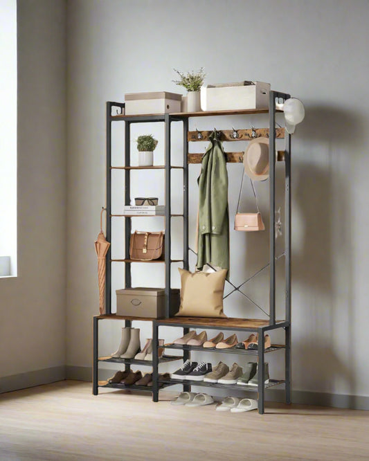 Multifunctional entryway rack with shelves, hooks, and shoe storage in a room.