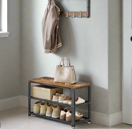 Rustic brown industrial shoe bench with 2 black mesh shelves and sturdy steel frame in hallway setting

