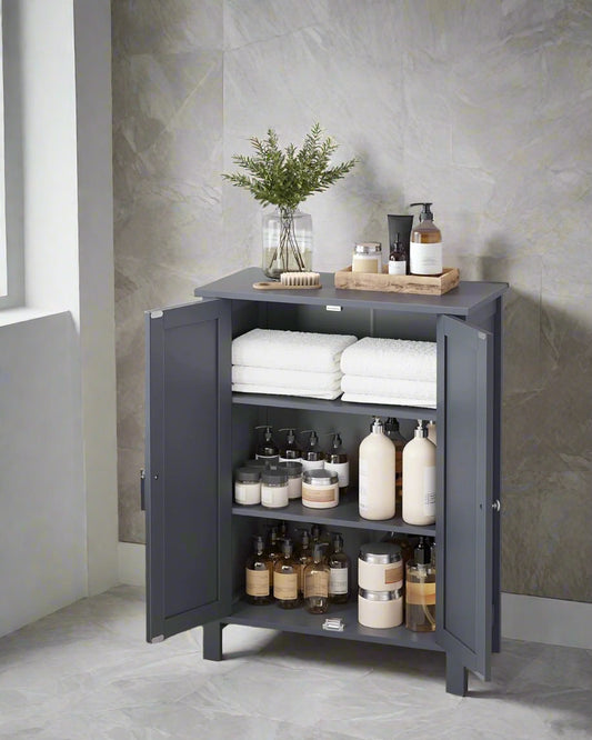 Bathroom floor cabinet with beadboard-style doors and silver knobs

